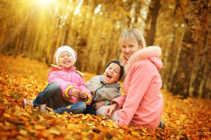 Kids playing in the leaves